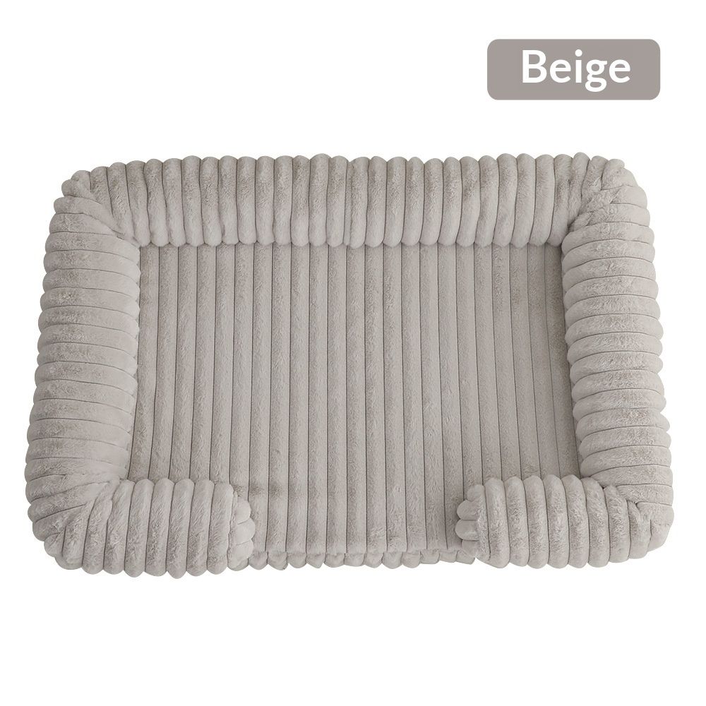 A beige ribbed plush dog bed with raised sides
